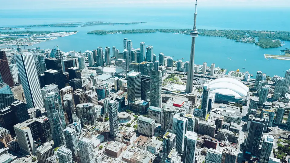 Toronto skyline and CN Tower beside Lake Ontario
